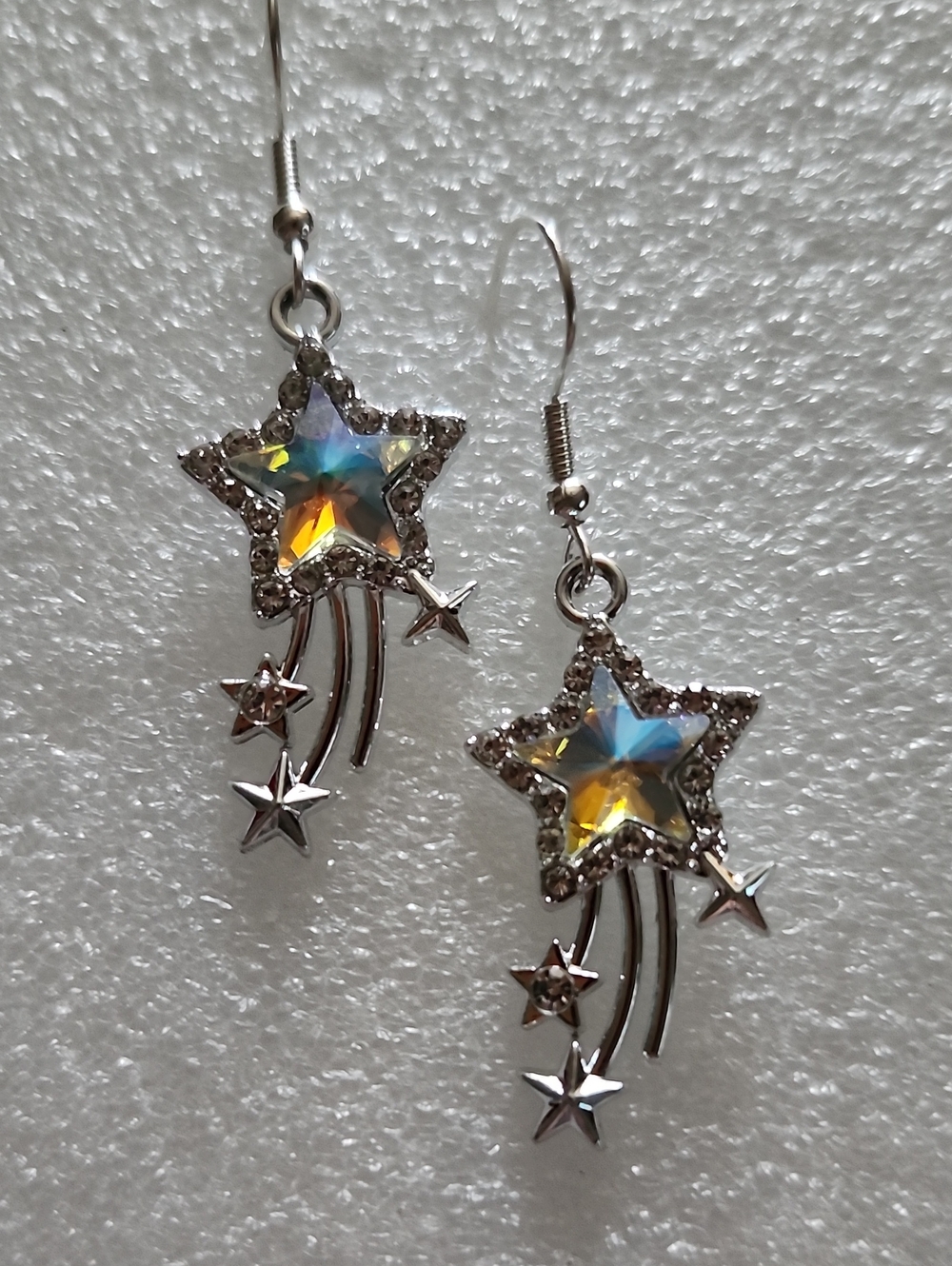 Hand Crafted Silver Star Dangle Earrings with Iridescent Blue and Yellow Crystal